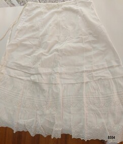 White lawn petticoat with pintucks and broderie anglaise lace on hem