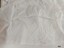 Plain white cotton fabric lining the hem of petticoat