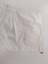 Back of left side of cotton sampler showing hand stitching on patch, seams, hem and frill