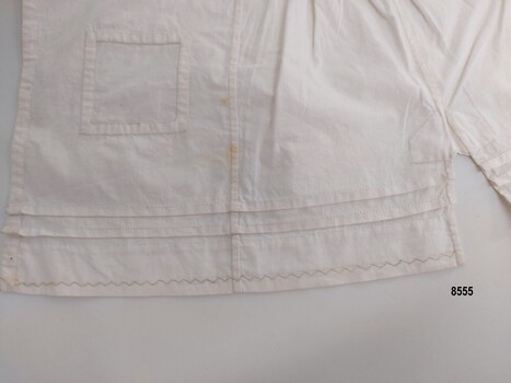 Sampler showing hand stitched inset square patch, pintucks, inset gusset,french seams and decorative embroidery