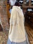 View of right side of double cape with collar.
