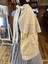 View of left side of double cape with collar.