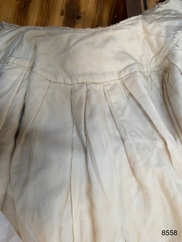 View of the pleated lining on the underneath cape.