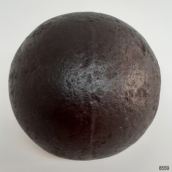 Cannon ball has a ridge around its circumference from the cast mould