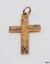 Gold cross has loop and ring, and hand engraved front