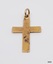 Cross's surface has nicks and pits and red-brown corrosion