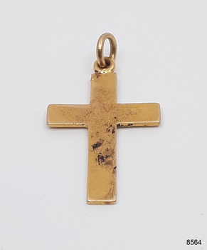 Cross's surface has nicks and pits and red-brown corrosion