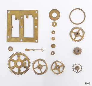 Sixteen brass parts from a carriage clock