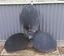 Painted propeller has three blades and pointed cap on the central boss