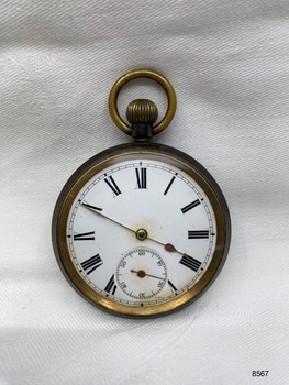 Front view of fob watch with roman numerals.