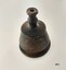 Small brass, bell shaped finial topped with a narrow double concave hollow neck