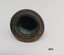 The base is round with a defined edge. The internal space is bell shaped with some evidence of verdigris on the surface.