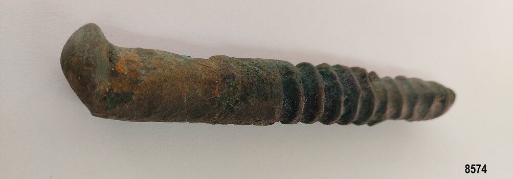 Worn metal bolt with flattened top