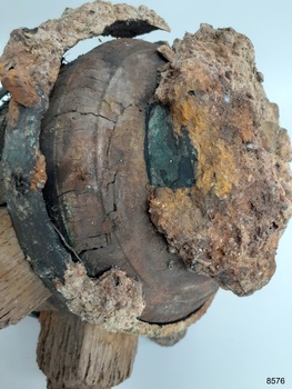Wood is split and cracked. Metal has come away from wood. Thick encrustations on wheel.