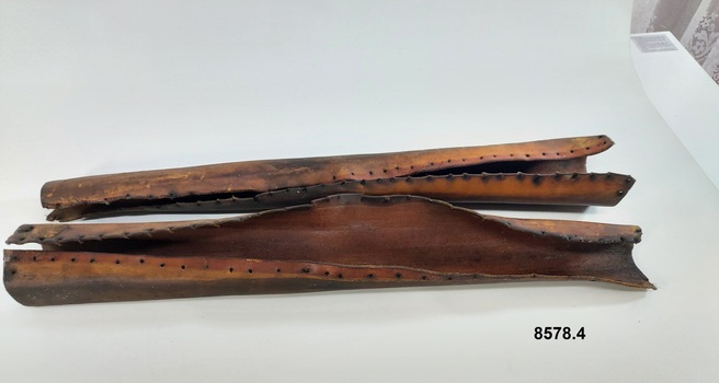 Leather dray shaft protectors with lacing holes along each edge