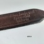 Maker's name stamped onto end of leather strap