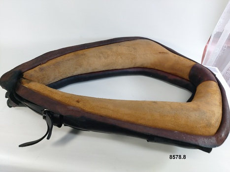 View showing underneath of horse collar and two adjustable straps and buckles
