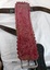 A layer of red felt padding on the underneath of the back pad