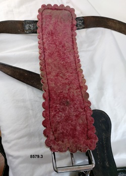 A layer of red felt padding on the underneath of the back pad