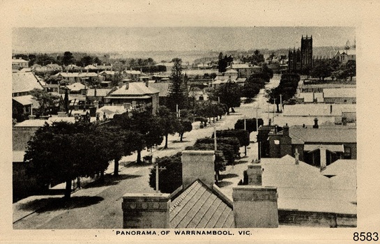 View of the Presbyterian Church at the north end of a tree lined Street