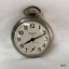 Front view of silver toned fob watch.
