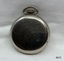 Back view of silver toned fob watch.