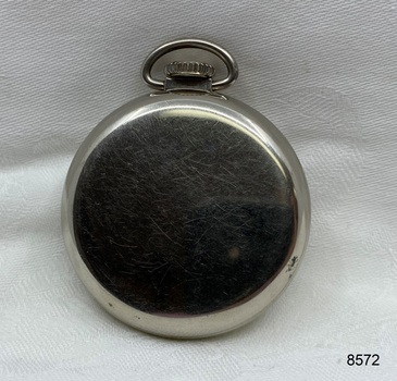 Back view of silver toned fob watch.