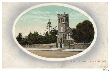 Rectangular postcard with oval cameo image of a stone church flanked be trees, behind a stone fence