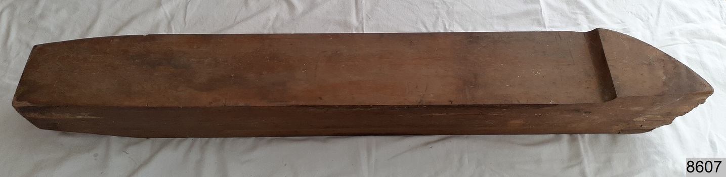 Laminated wood formed to make a half hull model of a ship, rear view