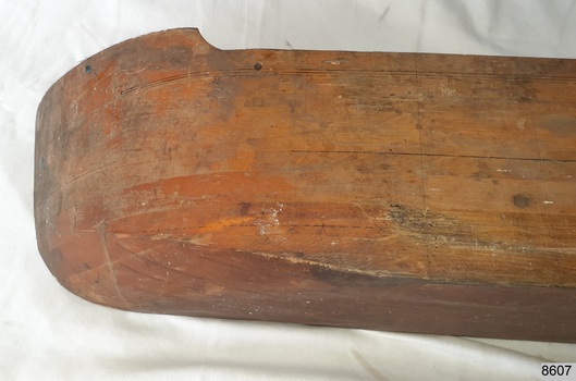 Laminated wood formed to make a half hull model of a ship, bow view