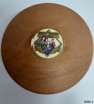 A wooden box, base and lid, originally containing cosmetic powder. Label on top stating Old English Lavender.
