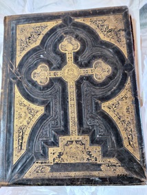 Brown leather front cover embossed with gilt detailing