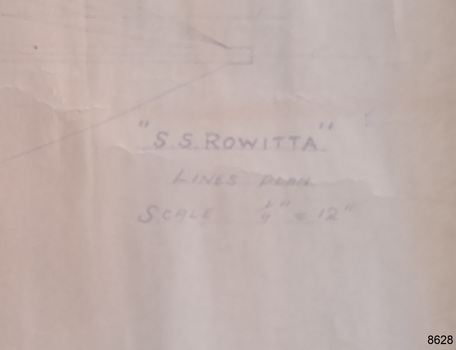 Close-up of inscription on front of plane, with title of plan