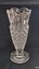 Clear cut glass vase with wide mouth tapering to a narrow stem on a round base