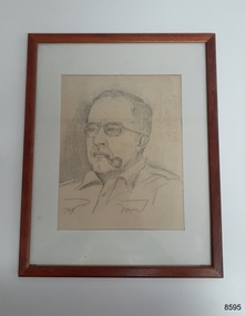 A pencil drawing of head and shoulders of Dr William Roy Angus, Surgeon and Oculist, with frame and glass.