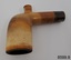 A collection of six pipes. Two of the pipes are resting in their protective cases. One of the pipes is the old fashioned clay type.