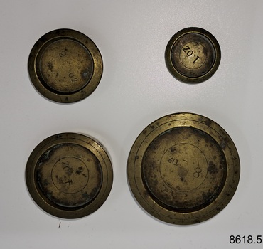 Four weights for postal scales - 1 oz., 2 oz., 4oz. and 8 oz.