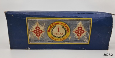 Rectangular blue cardboard box with coloured rectangular label