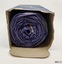 Profile of the rolled side of cotton wool inside an open-ended box. 