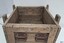 Wooden crate's pairs of handles at each short side are fixed to wood with strong metal bolts