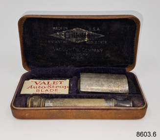 Safety razor and spare razor blades in case.