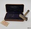 Safety razor and spare razor blades and carrying case.