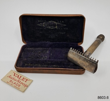 Safety razor and spare razor blades and carrying case.