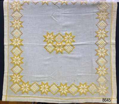 Flat view of tablecloth to show overall pattern