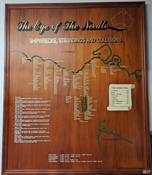 Wooden board in frame, displaying coastline of Victoria with locations of whipwrecks