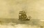 Postcard with sepia photo of a sailing ship near a shallow rocky reef
