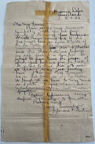 Upright handwritten script letter in black ink. Blue lined, yellowing paper has been repaired with an adhesive join down the centre.