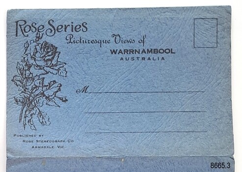 Textured blue card cover with image of a stem of a rose on the left
