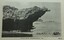 Large rock, shaped like the profile of an eagle's head and neck, overhanging the sea