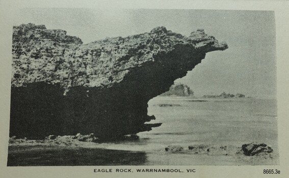 Large rock, shaped like the profile of an eagle's head and neck, overhanging the sea